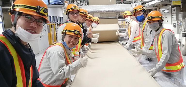 Technical trainees learn manufacturing on a gypsum board production line